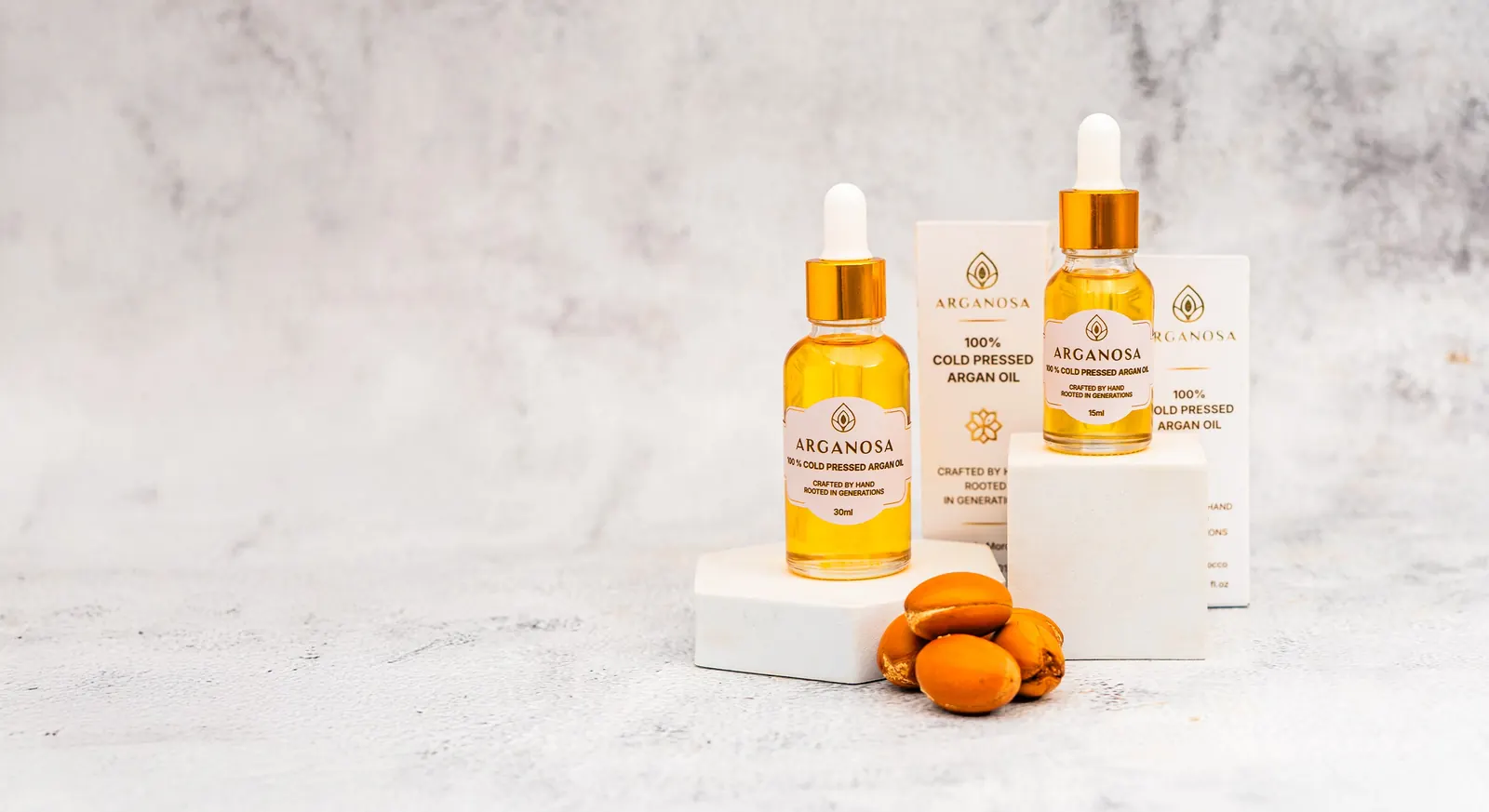 Arganosa 30ml and 15ml argan oil bottles with argan nuts